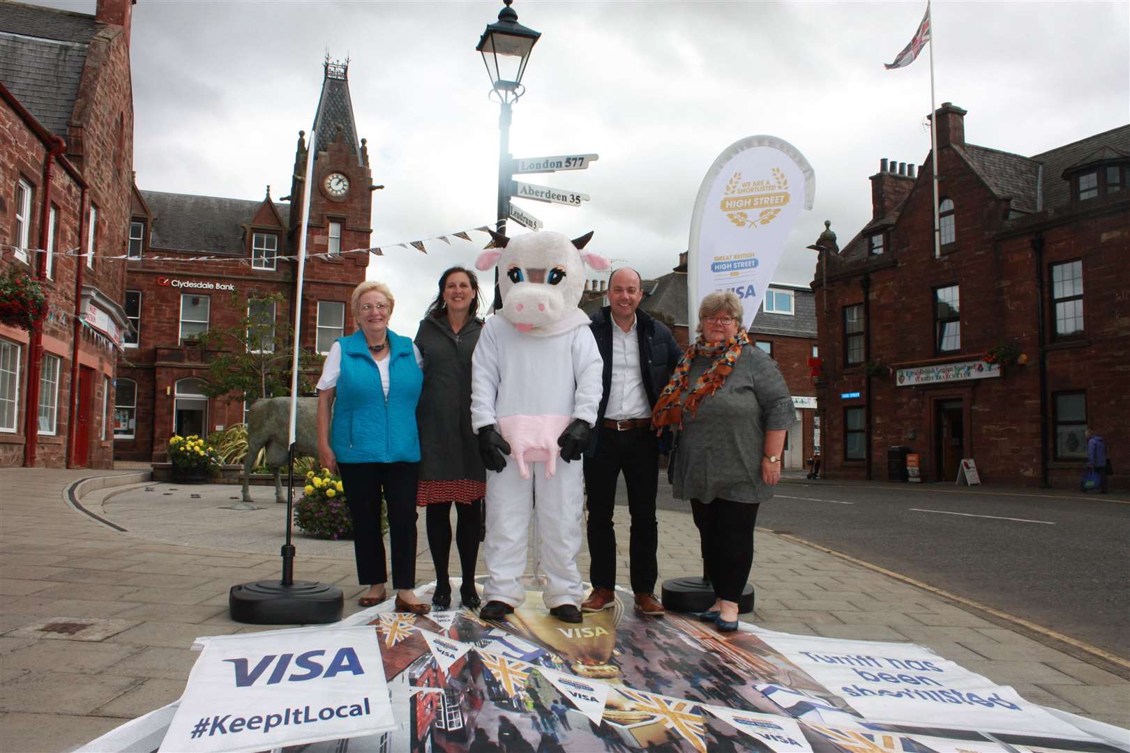 Turriff Business Associations' Rose Logan (left) and Marj Chalmers (right) with Visa judges Derek Band and Amy Gura. Pic: Grant Milne