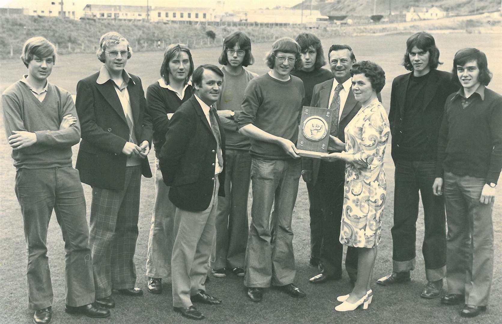 The first winners of the Felicity Cup in 1974, from left: Sandy Chalmers, Walter Robertson, John Lawrence, Paul Watson, Alan Kennedy, Ian Angus, Duncan Clark, Graham Hepburn, presented by junior convenor Sandy Rennie, and John and Kathleen Mair, owners of the fishing boat Felicity who donated the trophy for inter-club competition.