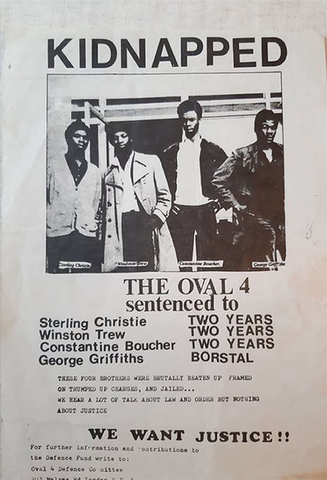 A poster calling for justice for the Oval Four (Winston Trew/PA)