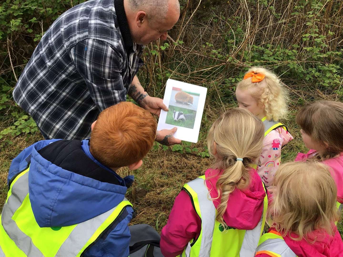 Pupils from Lady Cathcart nursery learn abou some of the diverse wildlife at the bird lane from Mr Devlin.