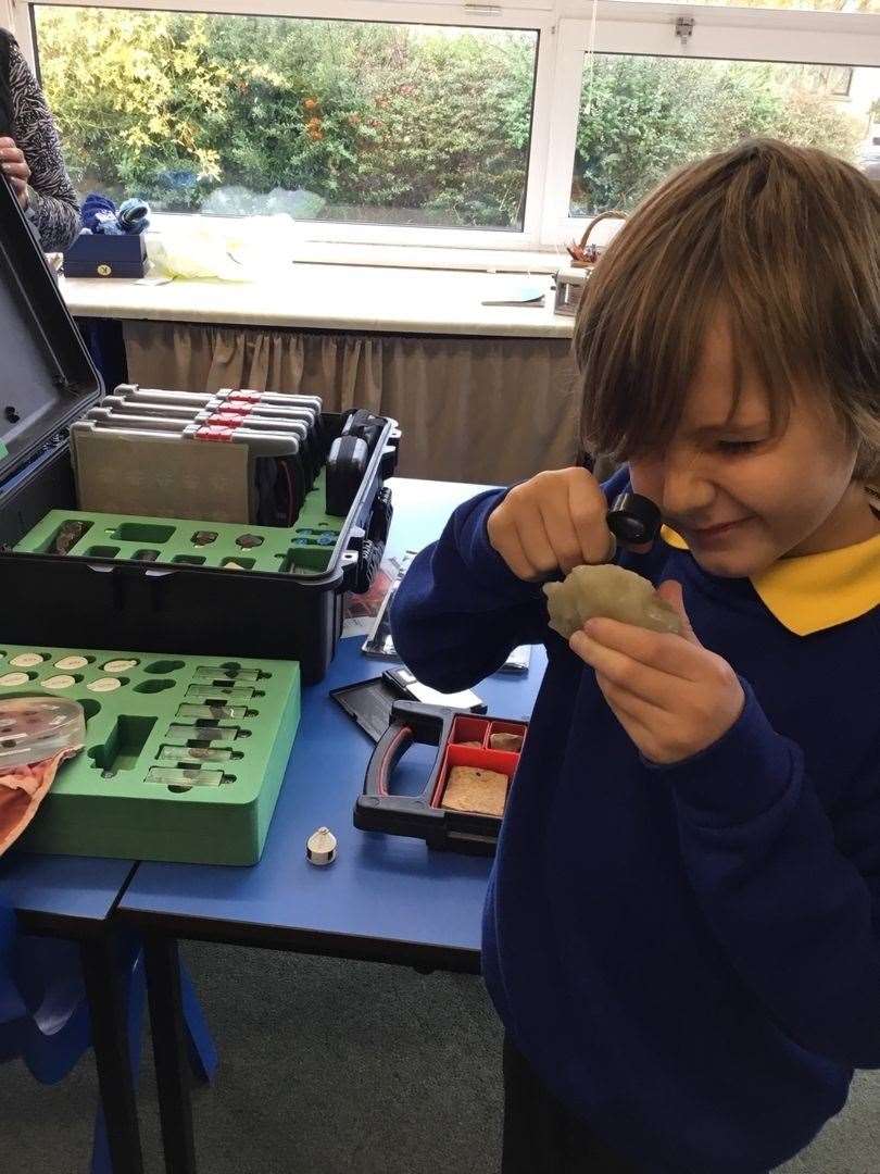 Reaching for the stars – a Cullen Primary pupil examines a piece of Moon rock.