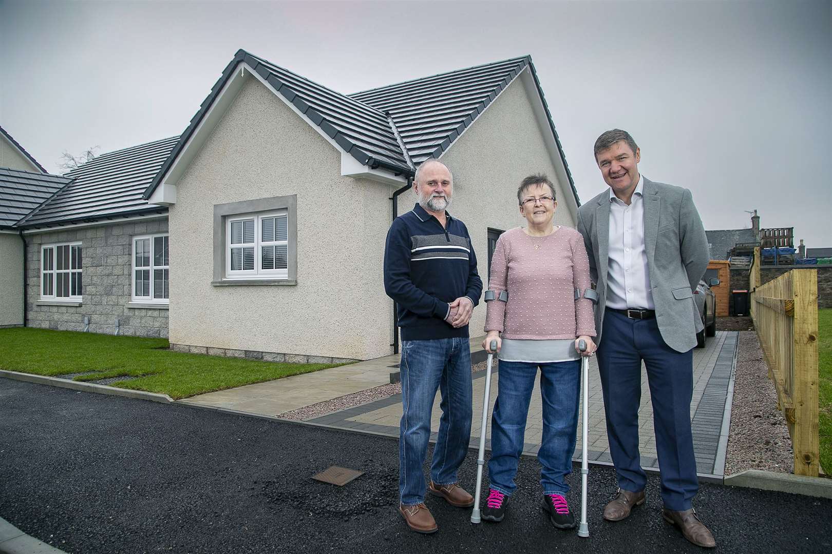 Alan and Jacqueline Scott with Allan Brown, managing director at Drumrossie Homes. Picture: Rory Raitt