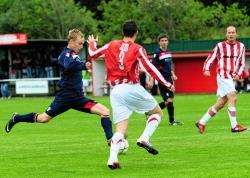 Formartine United left back Stuart Smith tries to block Turriff winger Stephen Gauld from getting his shot on target. (GM)