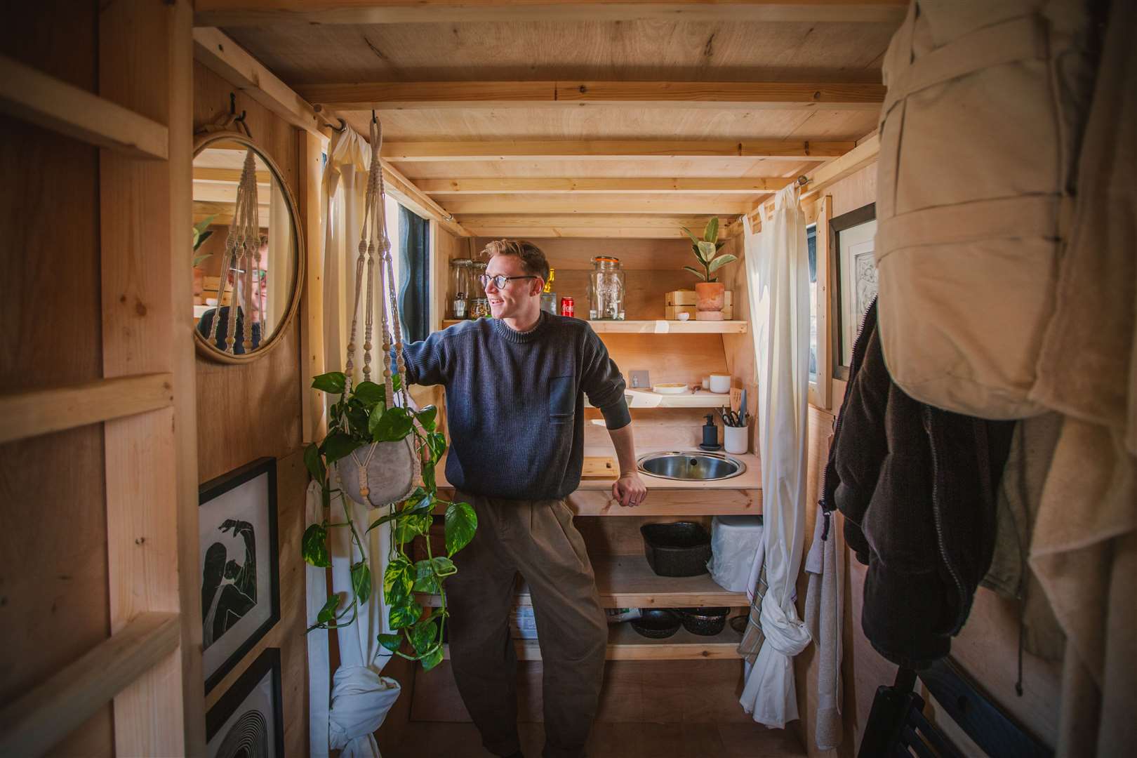 Harrison Marshall is aiming to live in the converted skip for a year (Katie Edwards/Skip House/PA)