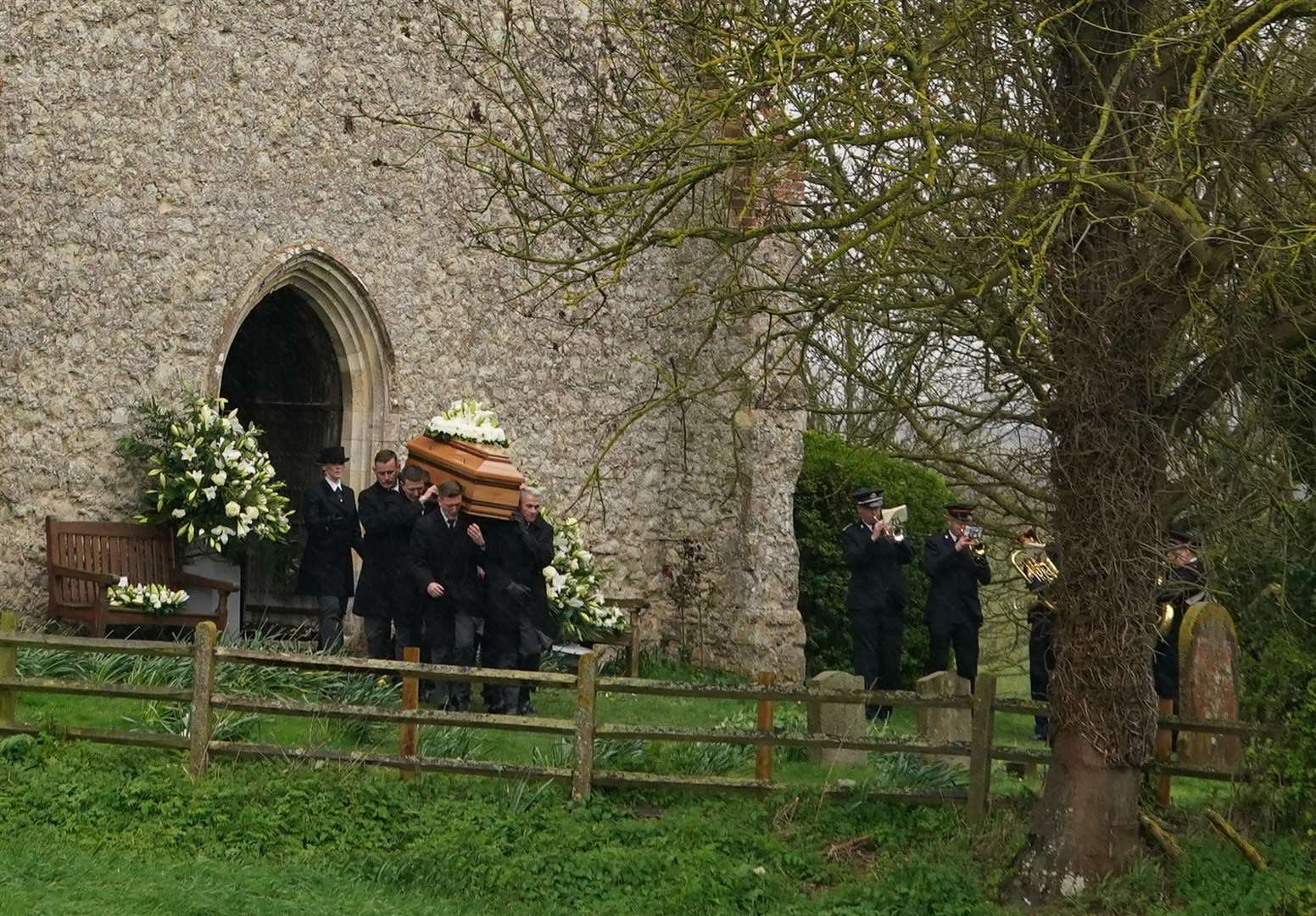 The coffin of Paul O’Grady is taken from St Rumwold’s Church following the service (Gareth Fuller/PA)