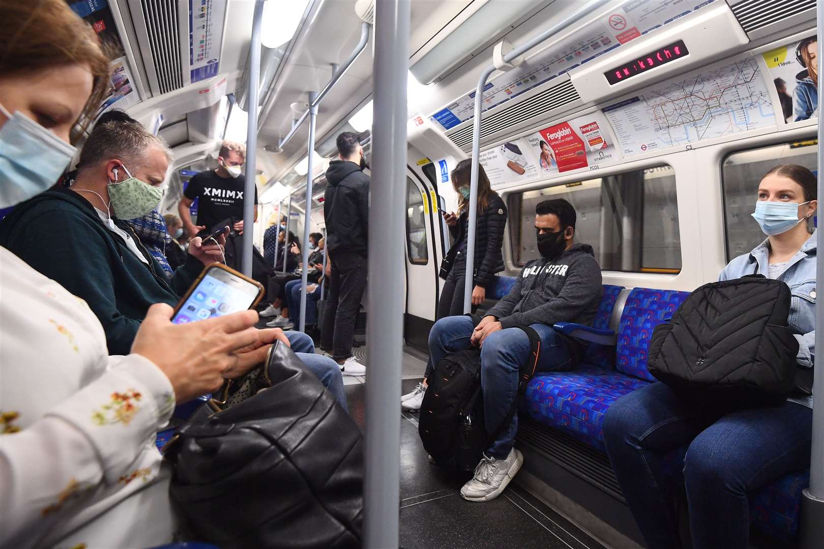 Passengers wearing face masks on the Jubilee Line in London (Victoria Jones/PA)