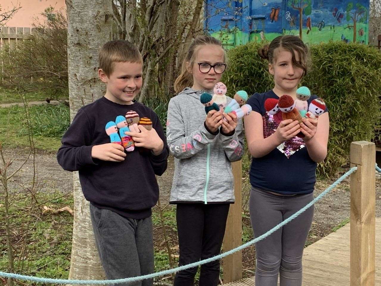 Strathburn School pupils with some of the hand-knitted worry dolls.