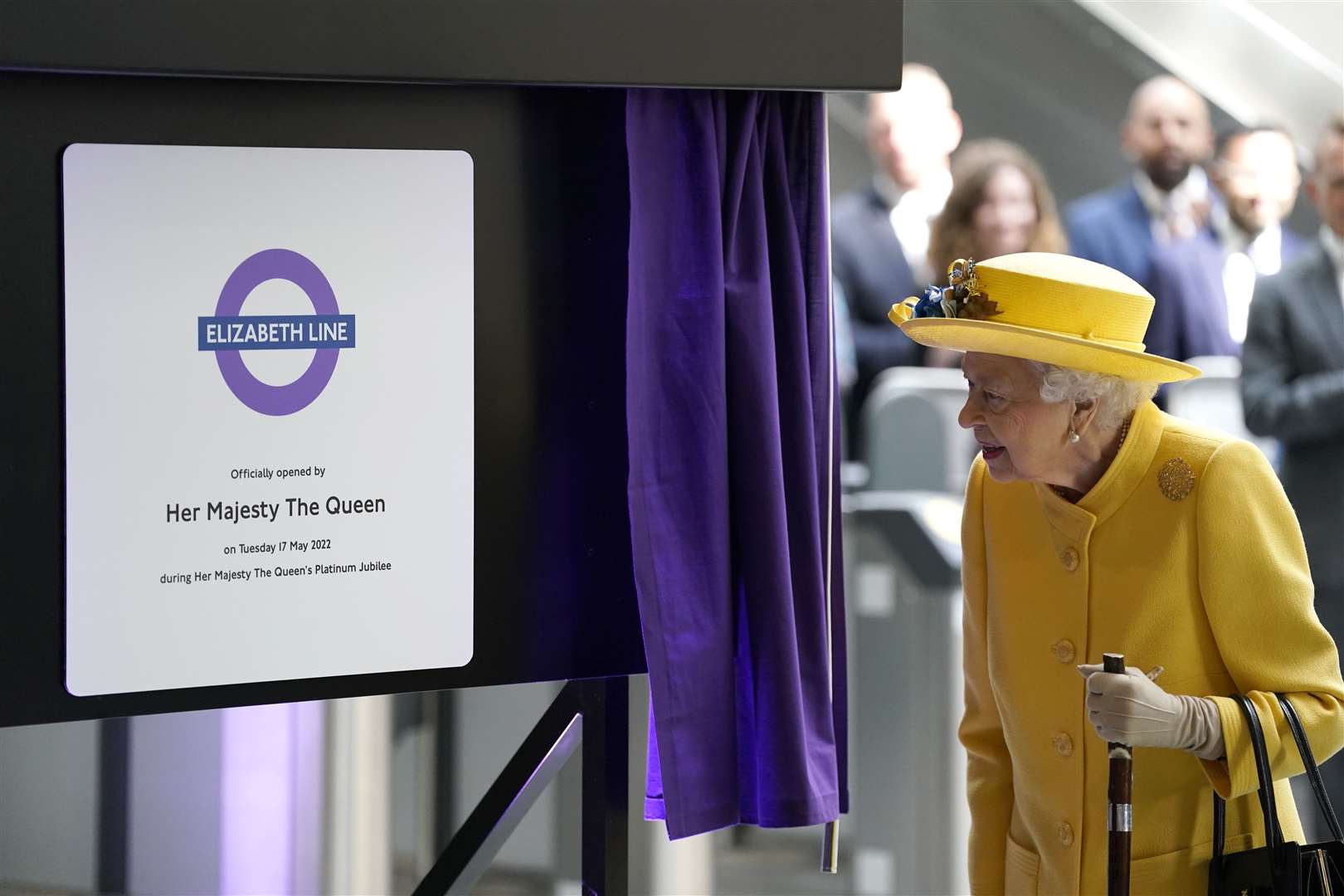 The Queen unveils a plaque to mark the Elizabeth line’s official opening at Paddington station in London in May (Andrew Matthews/PA)