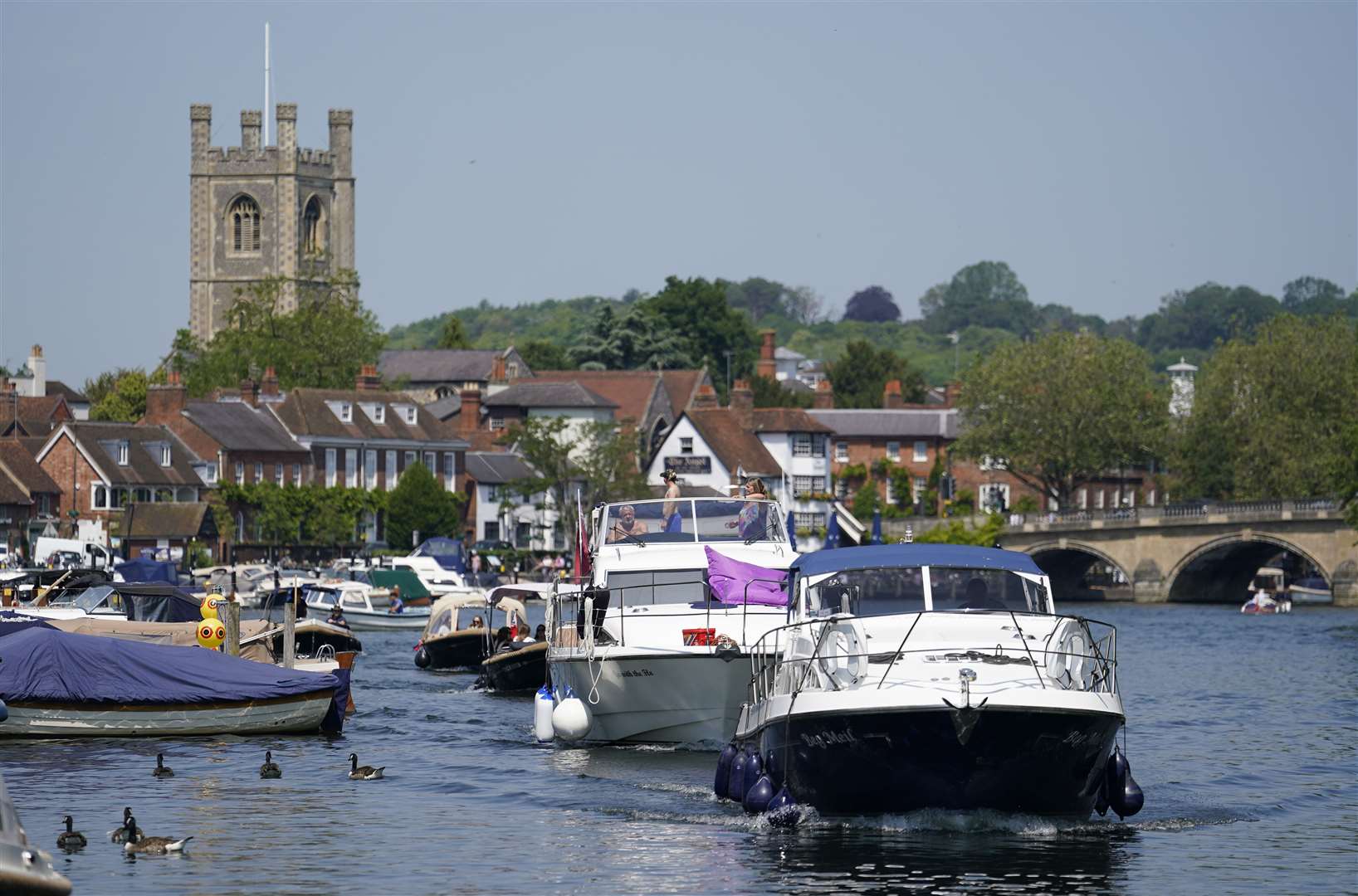 Pleasure boats are driven along the river in Henley-on-Thames (Andrew Matthews/PA)