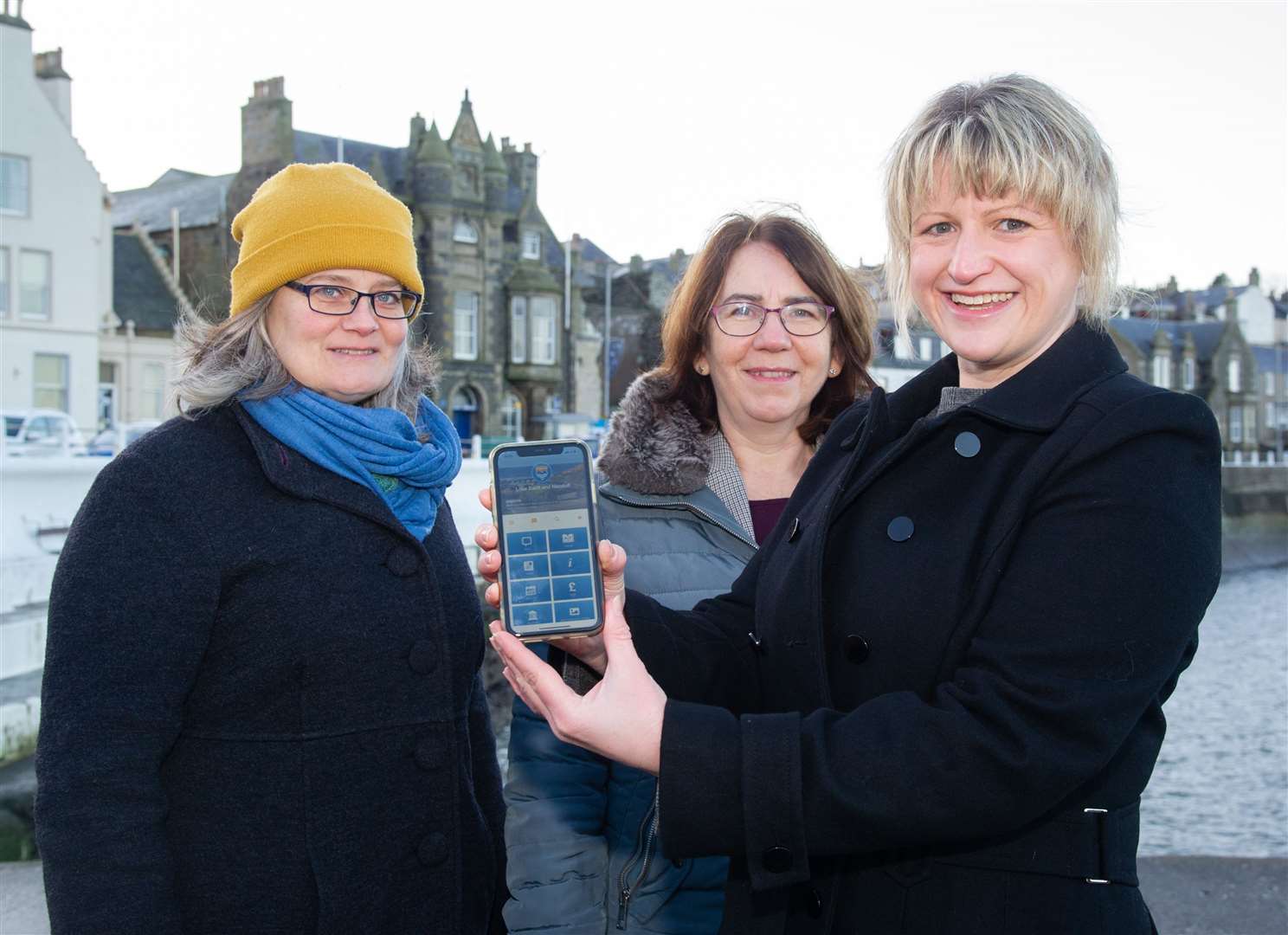 From left; Rachel Kennedy, Lynn MacKinnon and Vivien Rae with the new app for the towns. Picture: Daniel Forsyth
