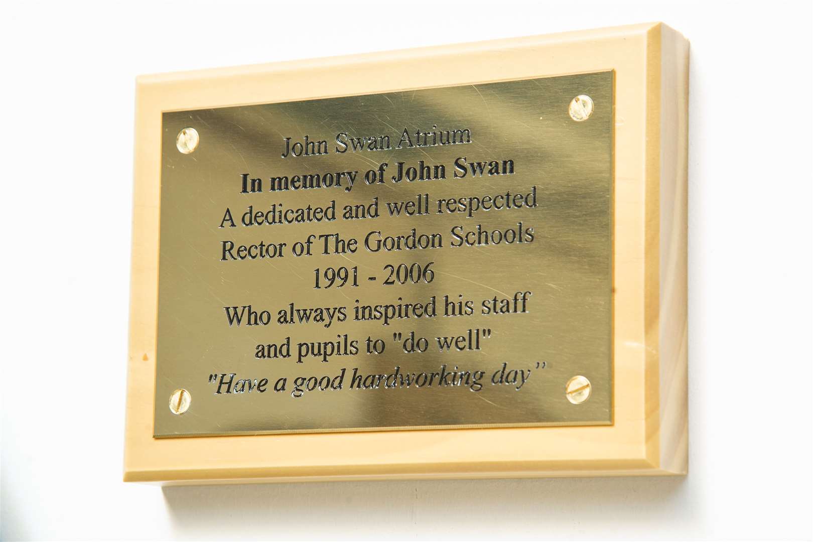 The commemorative plaque bears some of former rector John Swan's favourite sayings. Picture: Daniel Forsyth.