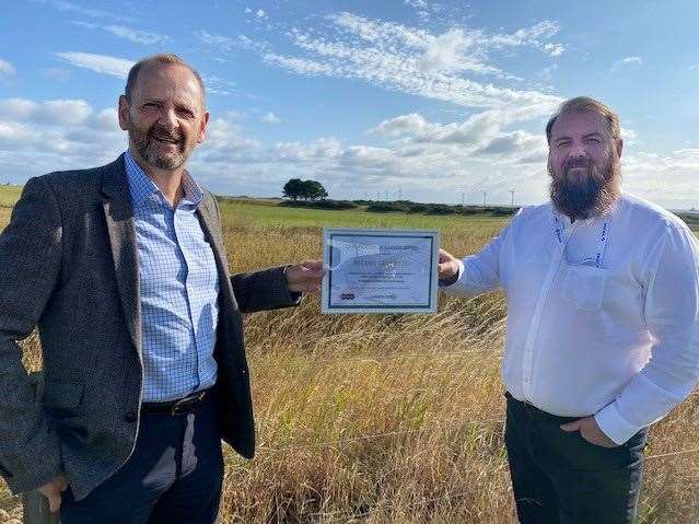 Nucore chief operating officer Phil Davie (left) and HSEQ manager Stuart Insch with the company's carbon neutral certificate.