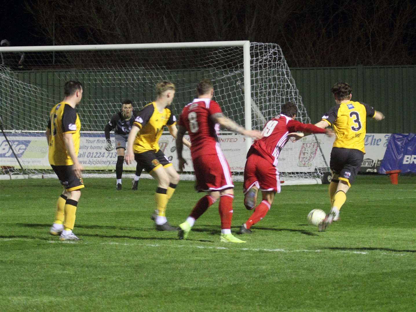 Formartine's Scott Lisle and Annan's Cameron Clark challenge for the ball.