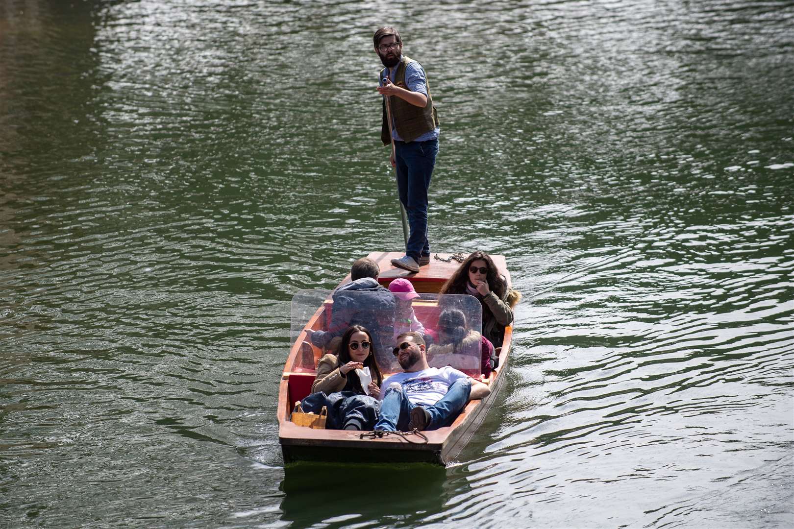 People enjoy a punt tour along the River Cam in Cambridge (Joe Giddens/PA)