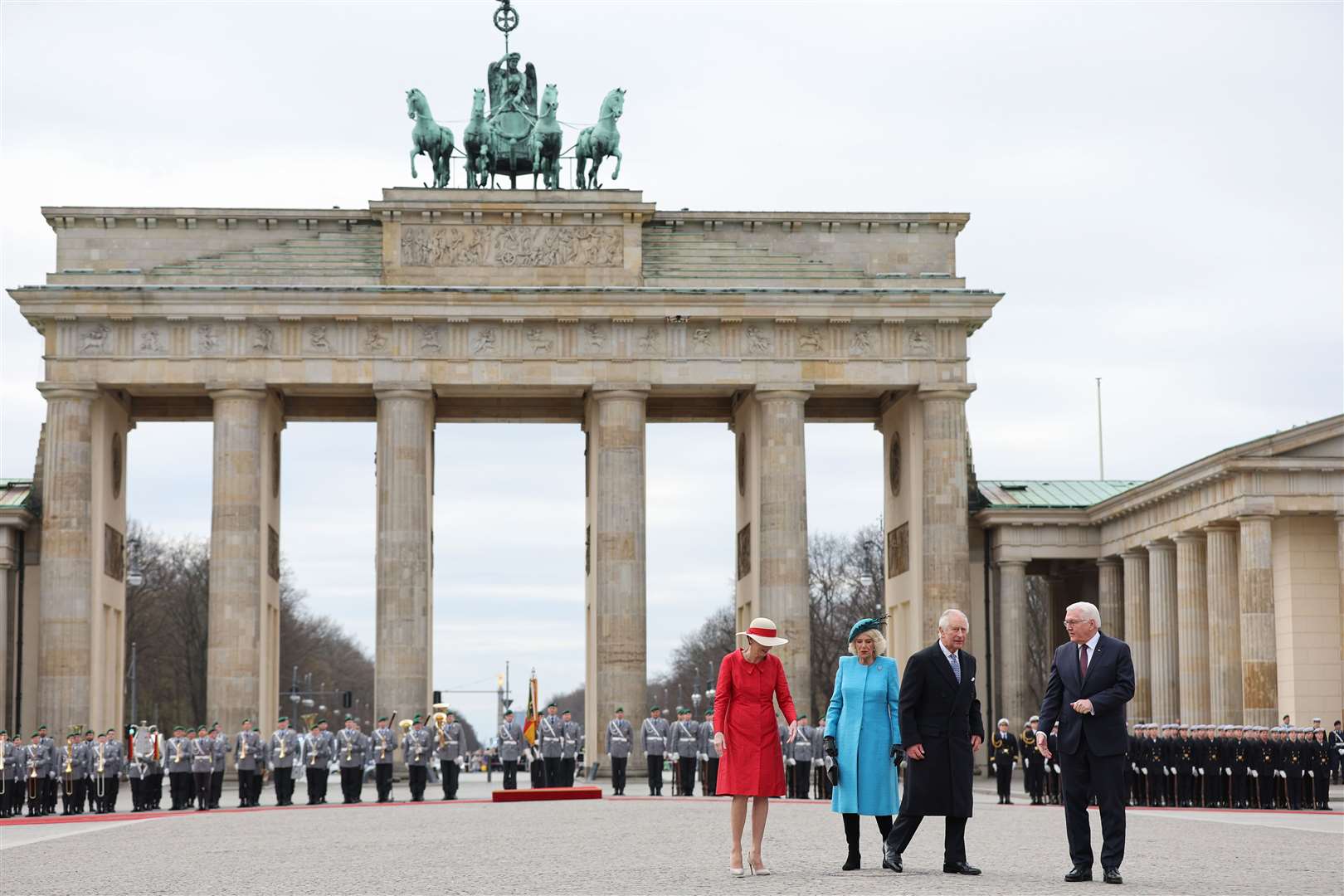 German president Frank-Walter Steinmeier, right, and his wife Elke Buedenbender, left, with the King and the Queen Consort during the ceremonial welcome at the Brandenburg Gate, Berlin, at the start of their state visit to Germany (Adrian Dennis/PA)