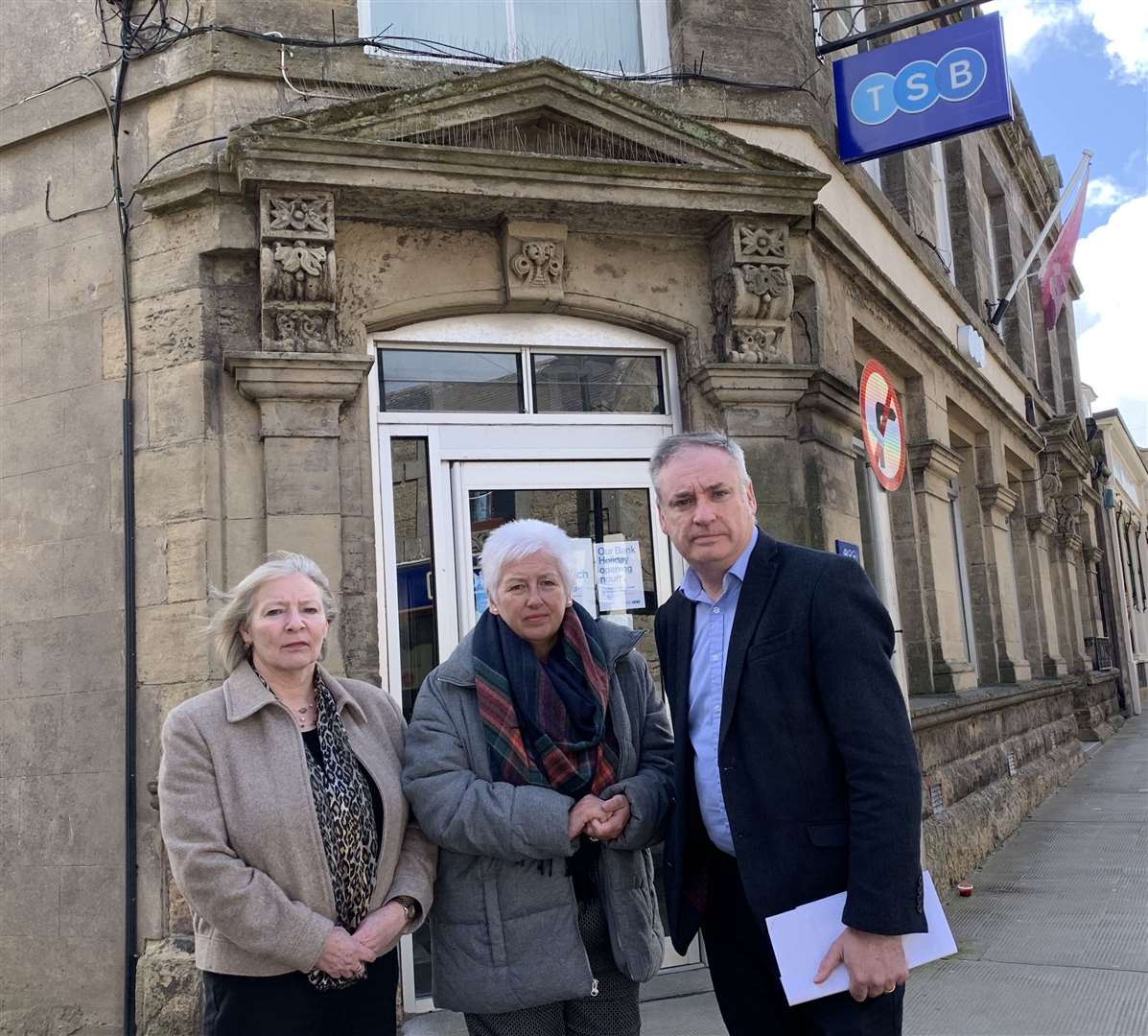 From left, Councillor Theresa Coull, TSB branch distribution director for Scotland Carol Anderson, and Richard Lochhead MSP outside the branch on Keith's Mid Street.