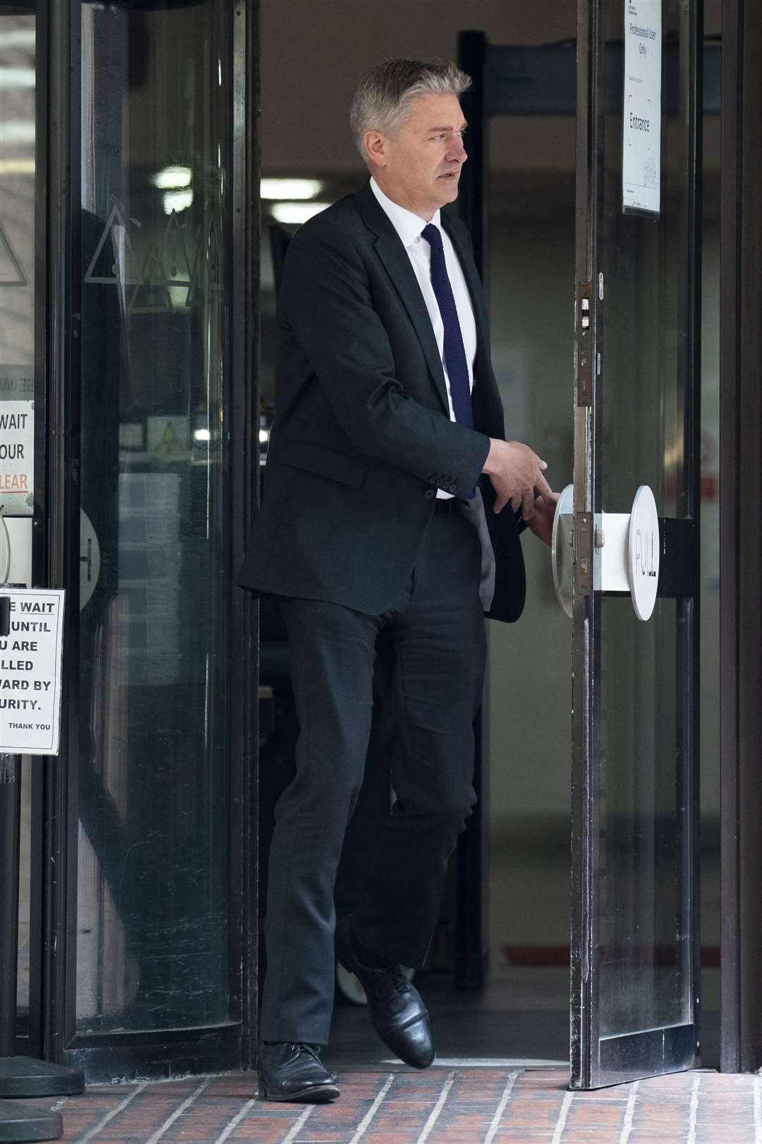Retired colonel Marcus Reedman leaves Southwark Crown Court (PA)
