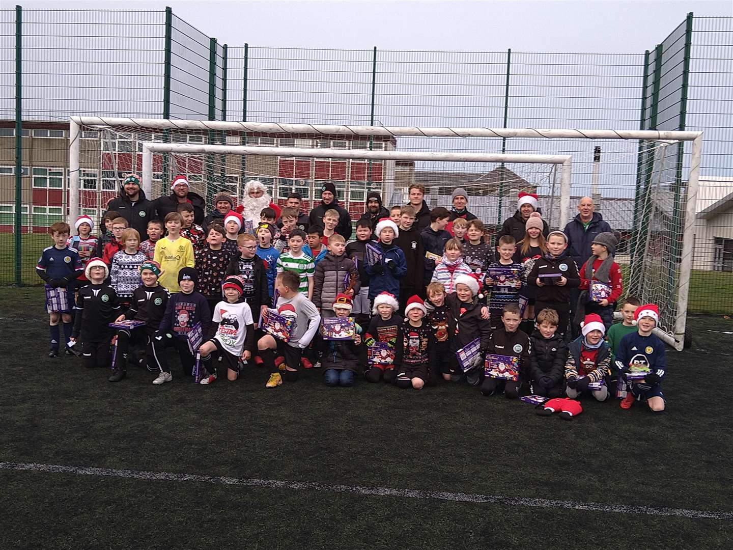 The P4-7 kids with coaches, helpers and, of course, Santa.