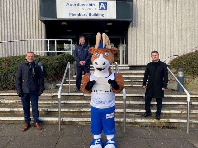 Active Schools Aberdeenshire mascot Archie the Stag with his letter to Santa. He is joined by (from left) Laurence Findlay, director of education and children services; Brian Mitchell, Active Schools manager; and Vincent Docherty, head of education.