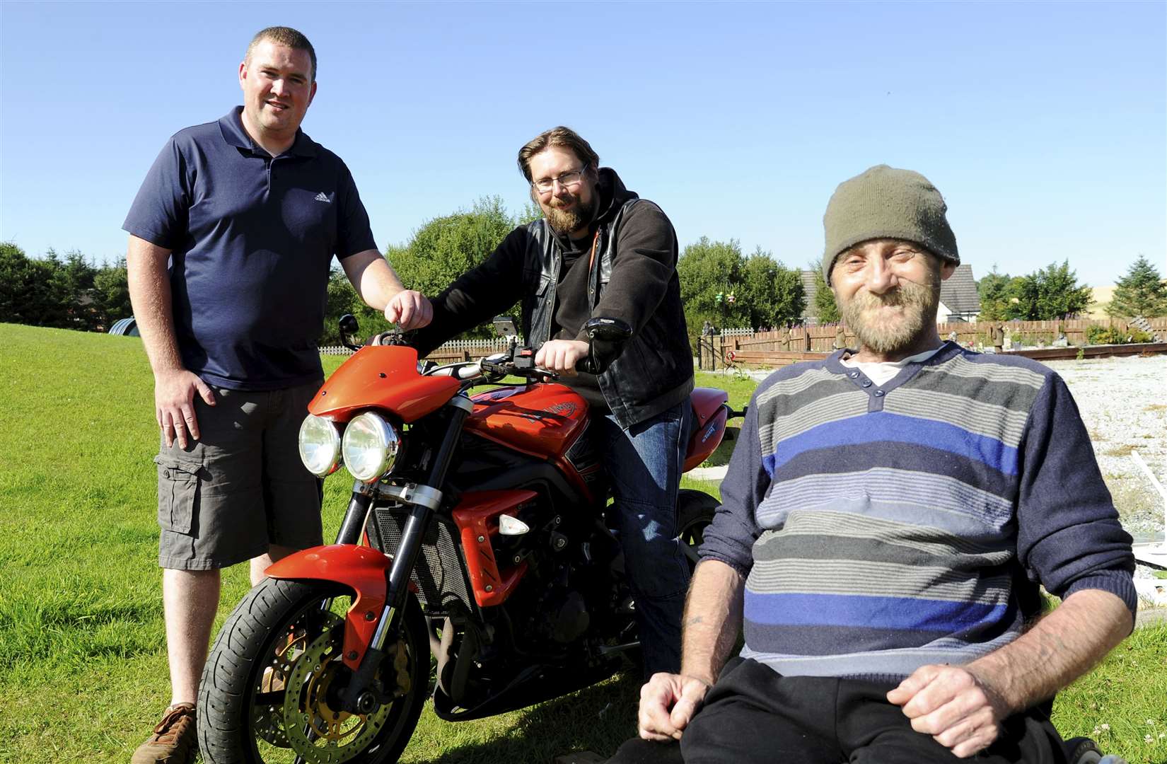 Iain Ogston [right] from Mulben with nephew Chris Stuart [standing] and biker Chris Macdonald. Picture: Eric Cormack