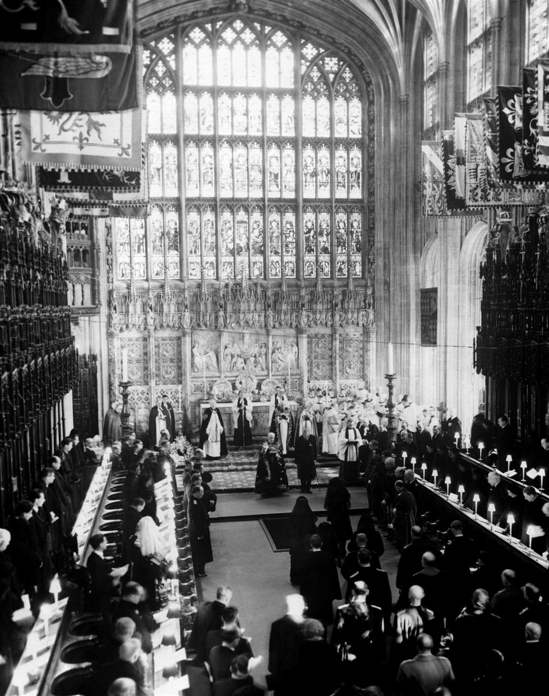The Queen standing next to the opening of the Royal Vault at the funeral of her father George VI in 1952 (PA)
