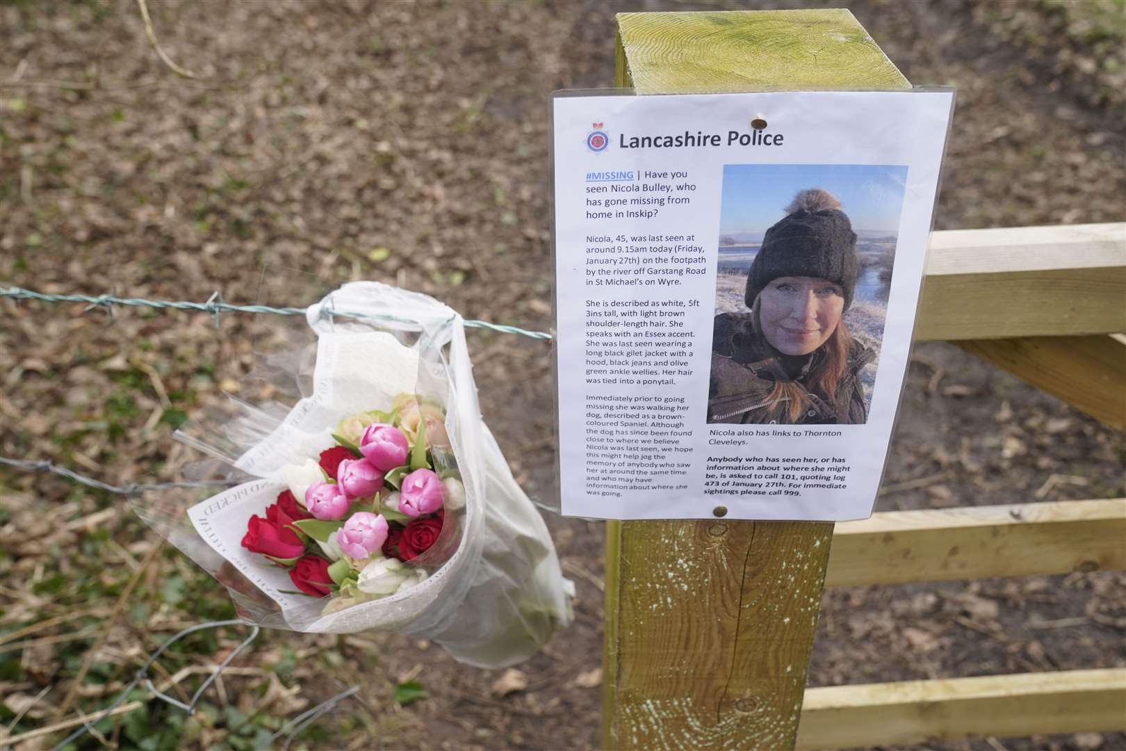 Flowers left by a missing sign in St Michael’s on Wyre, Lancashire, as police continue their search (Danny Lawson/PA)