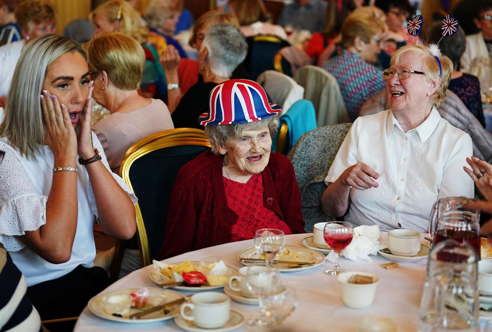 Fans young and old gathered in Belfast to raise a glass to toast the Queen at a tea dance (Brian Lawless/PA)