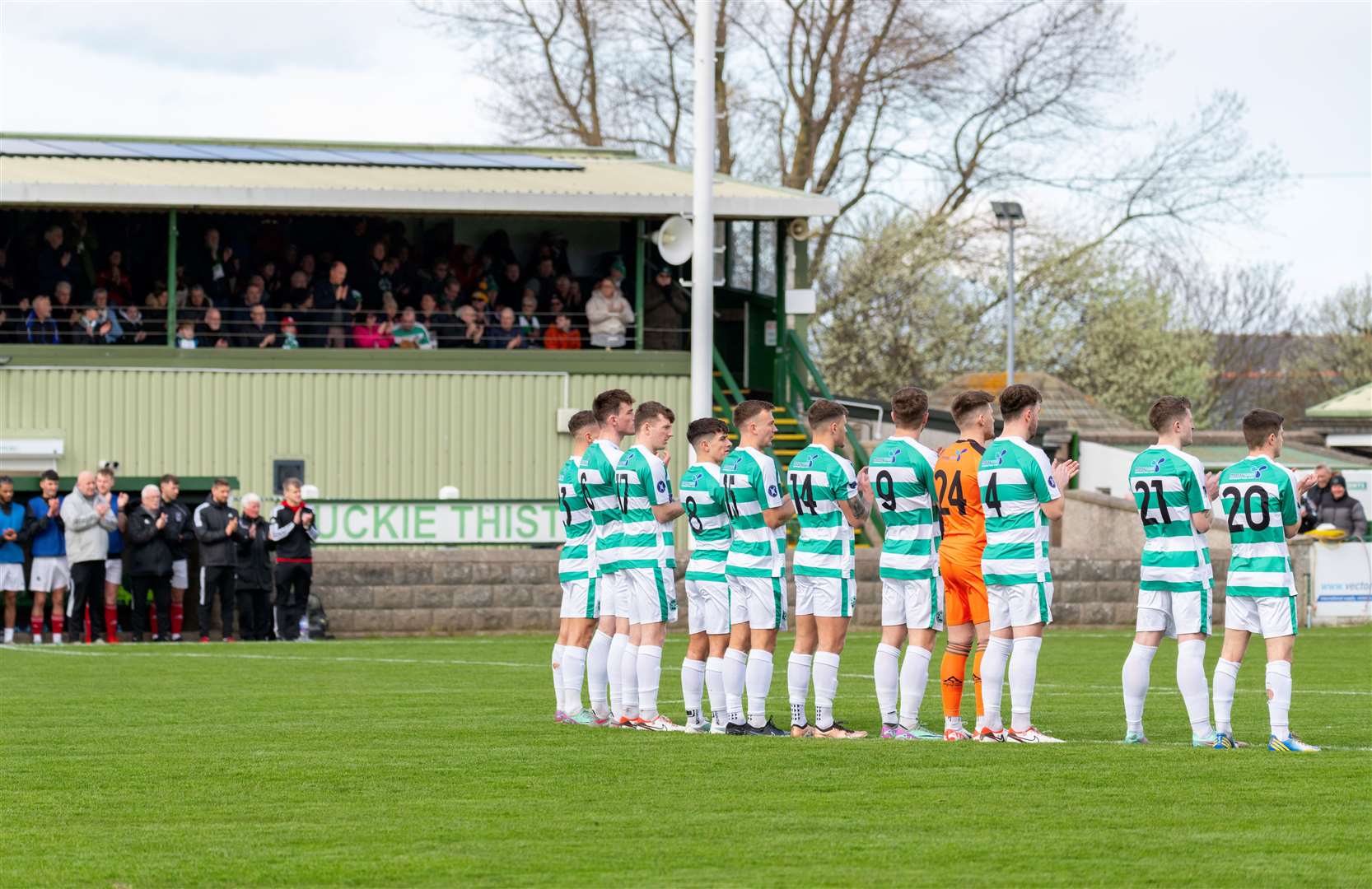 Buckie Thistle observe a minute’s silence in memory of Johnnie Cowie before their tie with Devernovale. Picture: Beth Taylor