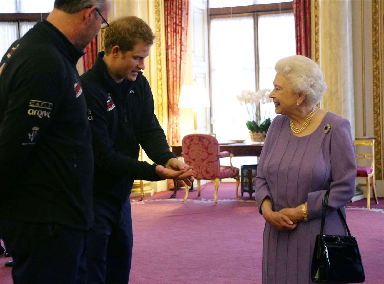 Harry and the Queen during a reception to meet teams of wounded servicemen and women (Yui Mok/PA)