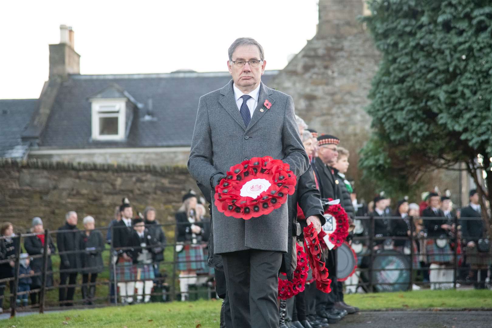 Deputy Lieutenant Dr John Harrington leads the way at the wreath laying...Keith Remembrance Sunday service and parade 2023. ..Picture: Daniel Forsyth..
