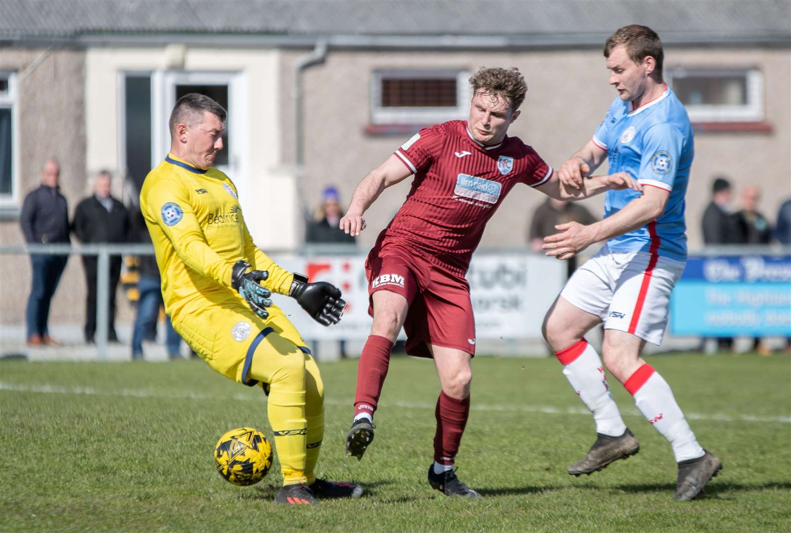 Keith forward Mikey Ironside knocks the ball past Wick keeper Graeme Williamson but is unable to score from the chance.Picture: Daniel Forsyth.