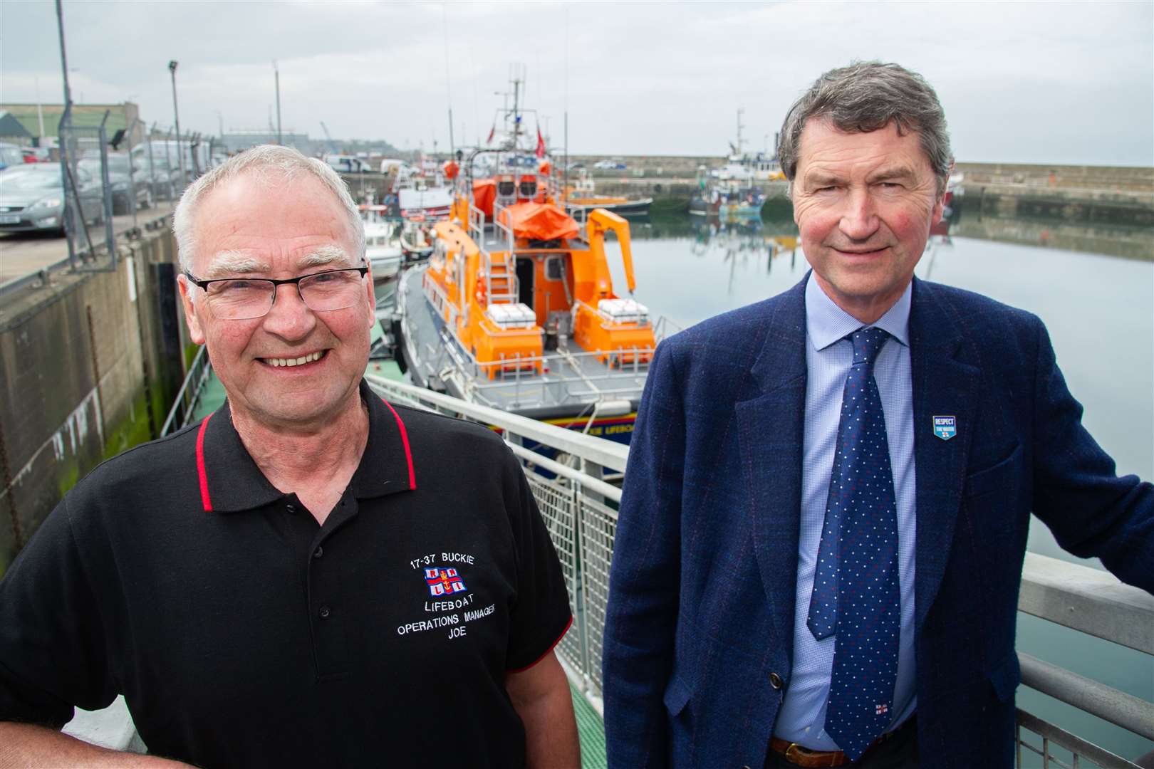 Buckie RNLI lifeboat operations manager welcomes Operations Committee deputy chairman Sir Tim Laurence to the lifeboat station. Picture: Daniel Forsyth. Image No.043745.