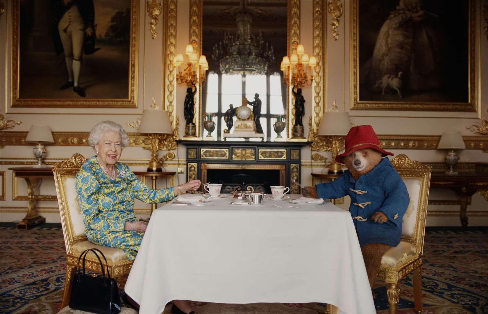 The Queen having tea with Paddington Bear. (Buckingham Palace/ Studio Canal / BBC Studios / Heyday Films)