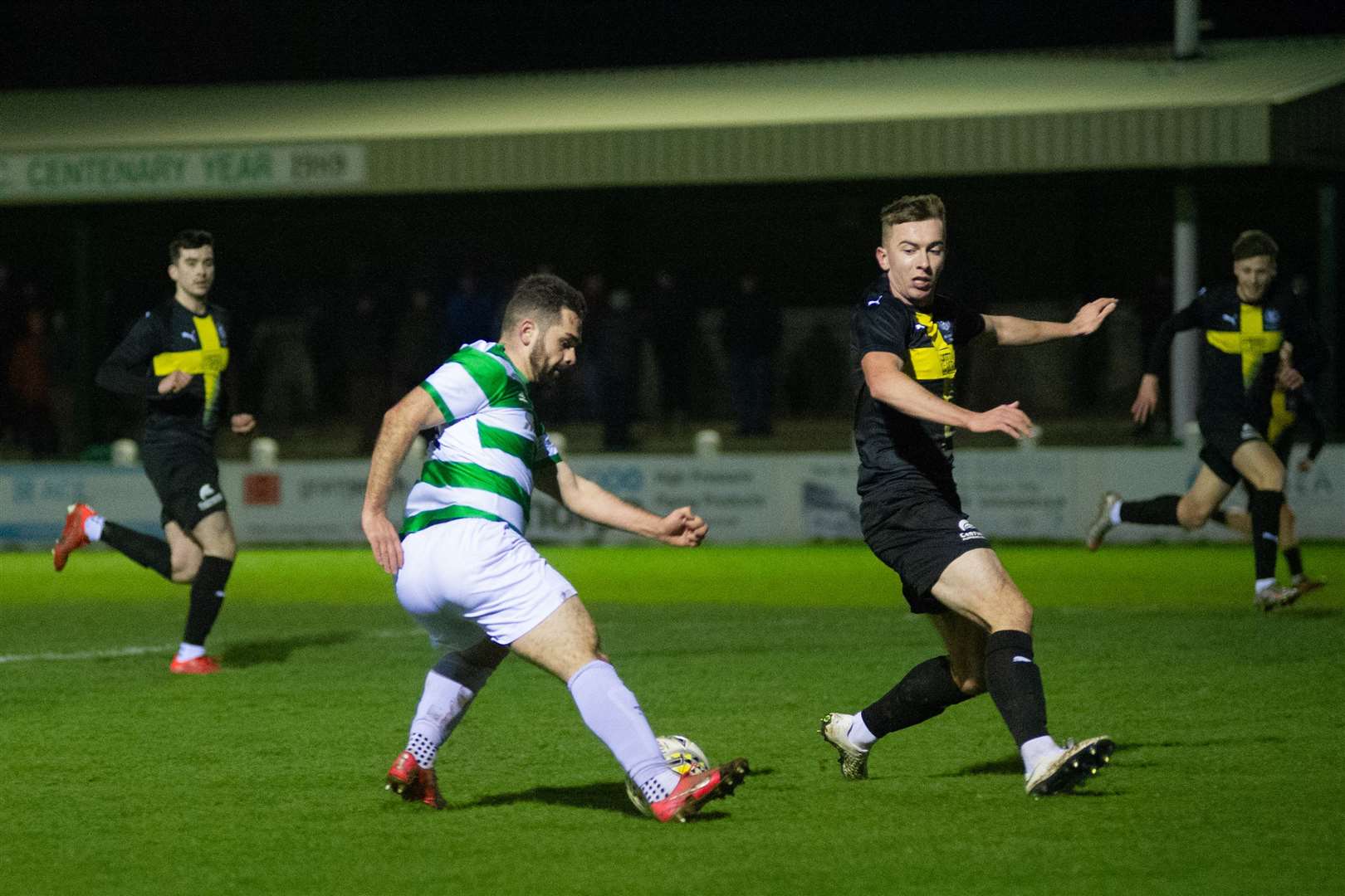 Buckie Thistle's Andy MacAskill twists his way past the Nairn defence in the lead-up to his goal. Picture: Daniel Forsyth..