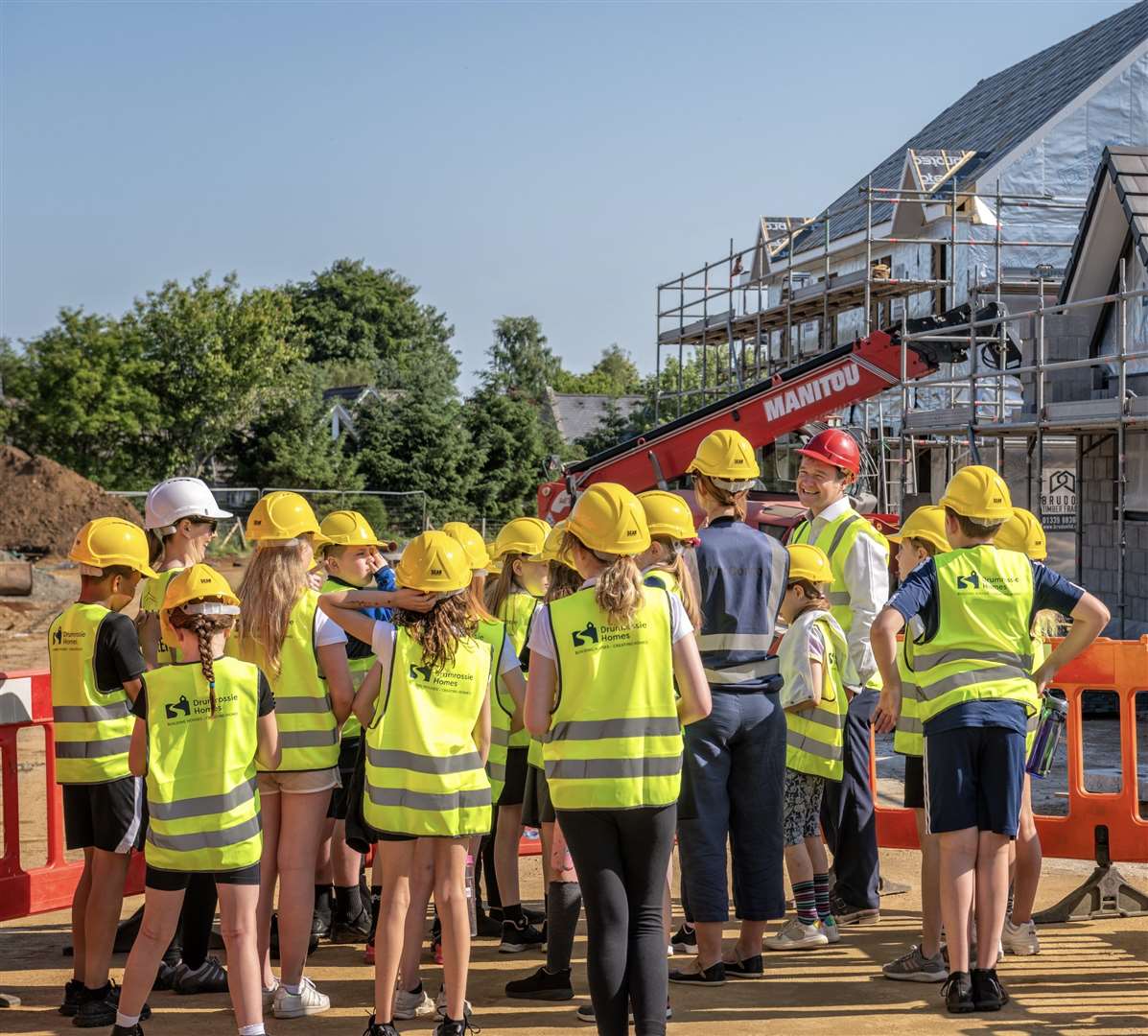 Pupils visited the site of the new homes being built in Insch.