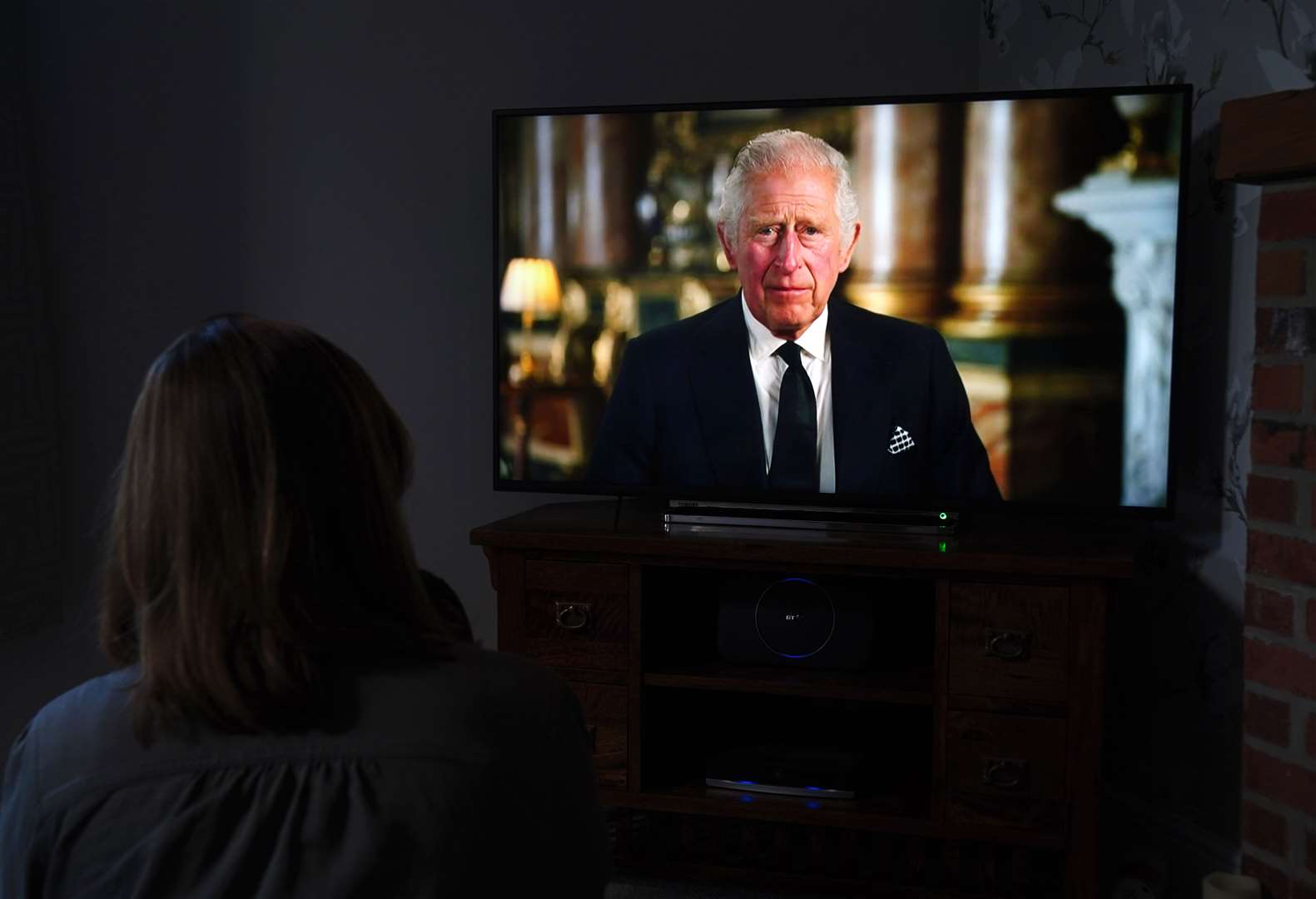 A child watching a broadcast of King Charles III’s first address to the nation (Mike Egerton/PA)