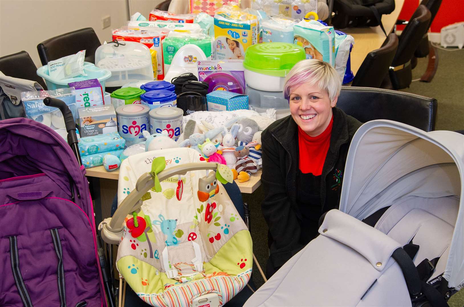 Emma Selway-Grant at Gordon Rural Action surrounded with some of the items in the baby bank. Picture: Daniel Forsyth.