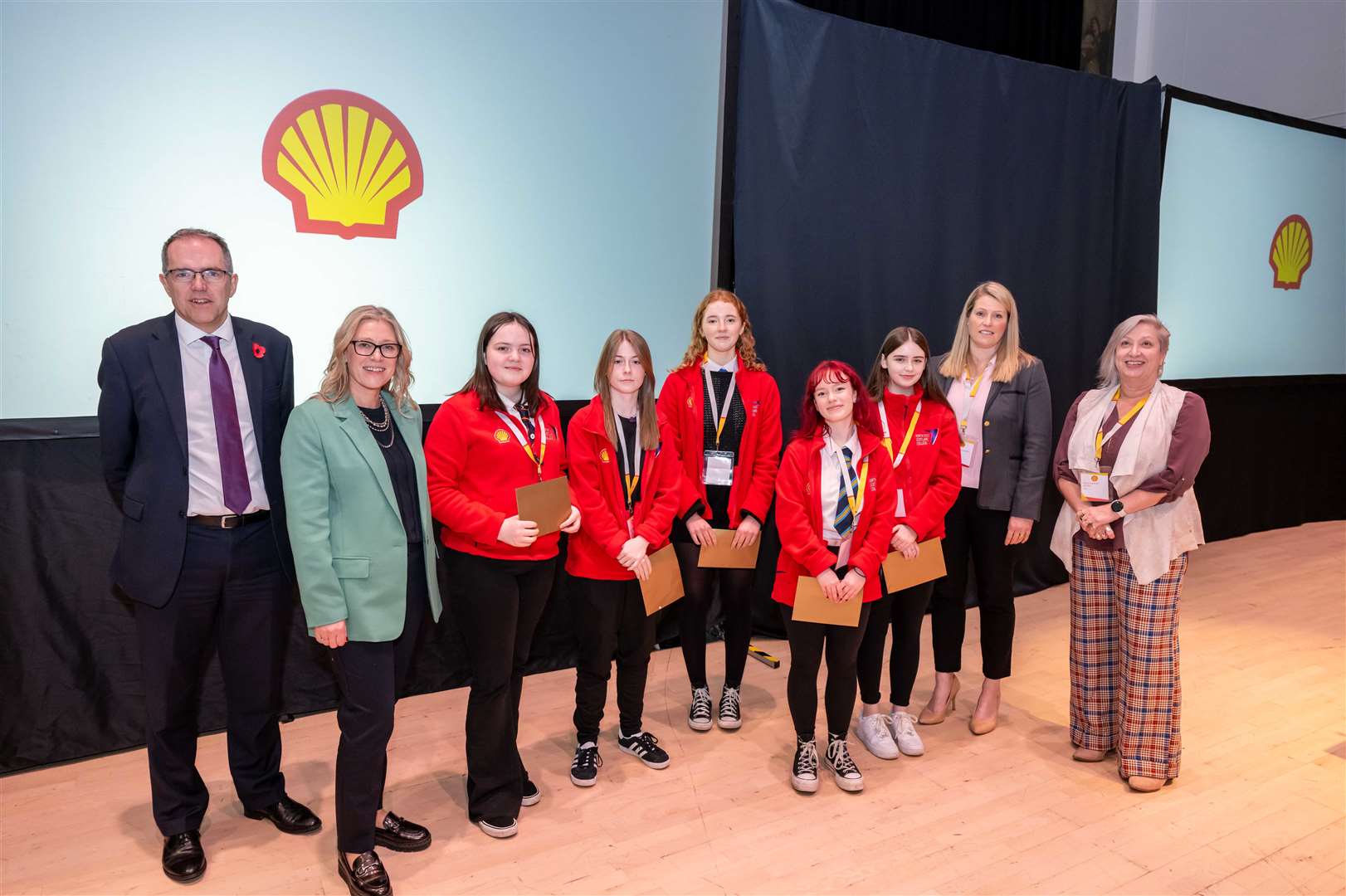 The winning team Katie Kelman, Ellie Grant, Erin Hay, Seren Murray and Lottie Gray, pictured with Simon Roddy, senior vice-president upstream at Shell UK, and the judges Gillian Martin, Minister for Energy and the Environment, Professor Lesley Sloss and Lucy Ferguson from Shell.