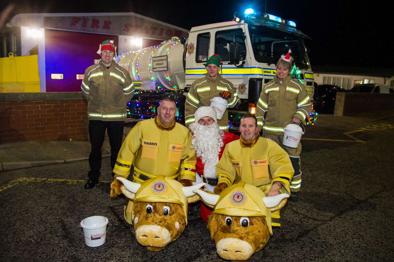 It's time to moo-ve it! Santa, the station's bovine mascots and members of the collection team get ready to head out to Portgordon on the first evening of street collections. Picture: Becky Saunderson..