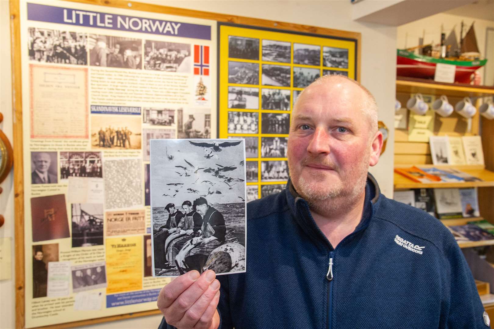 Professor Peter Reid, pictured with some of his work on Buckie's wartime Scandinavian refugees, will be one of the speakers at the conference. Picture: Daniel Forsyth