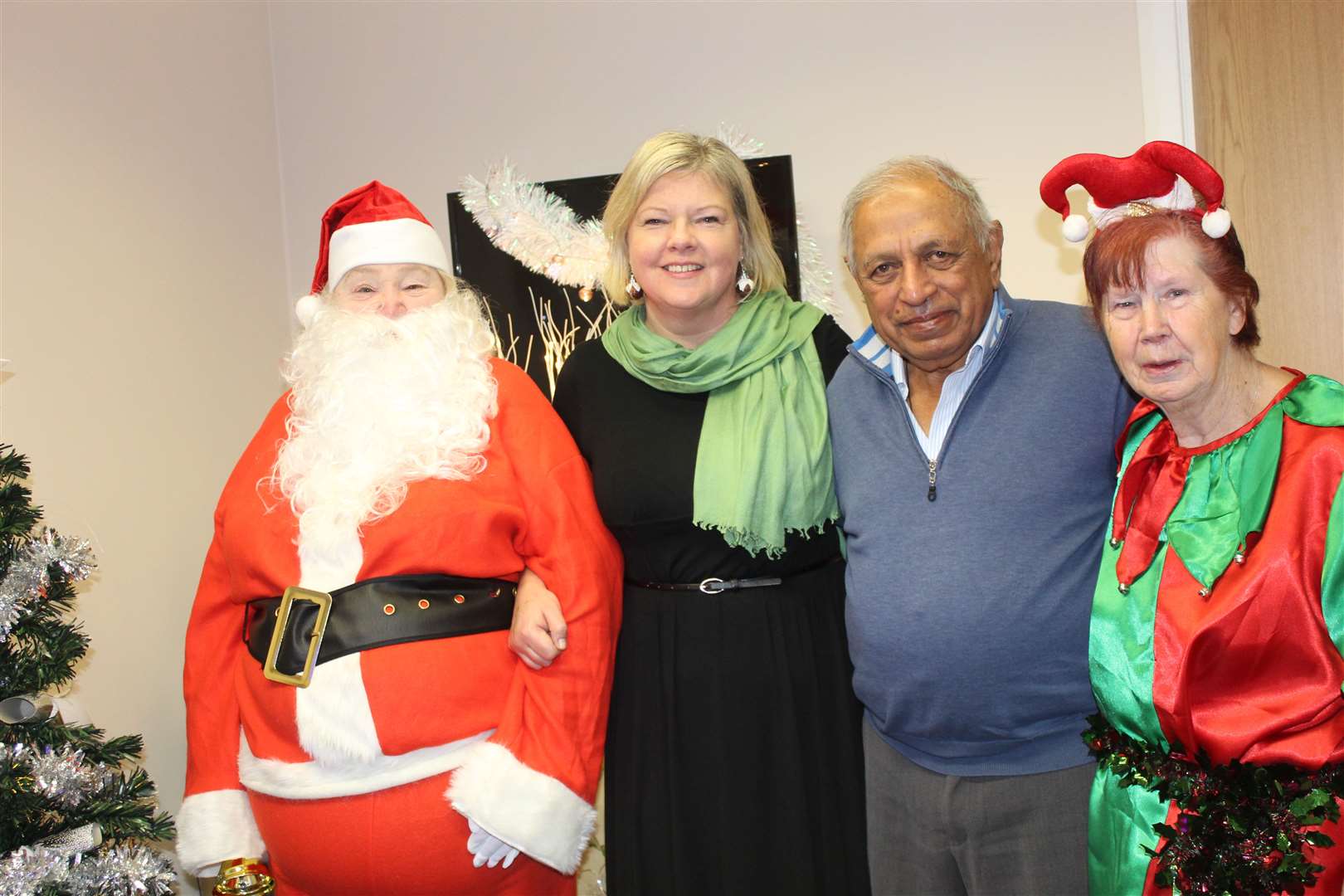 Mrs Santa (alias Yvonne Gordon) and her helper elf Kathy Coutts welcomed visitors Provost Judy Whyte and Pushp Vaid to her grotto at GO premises at West High Street, Inverurie on Saturday. Picture: Griselda McGregor