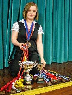 Swimmer Alix Gair with her medals and trophies.