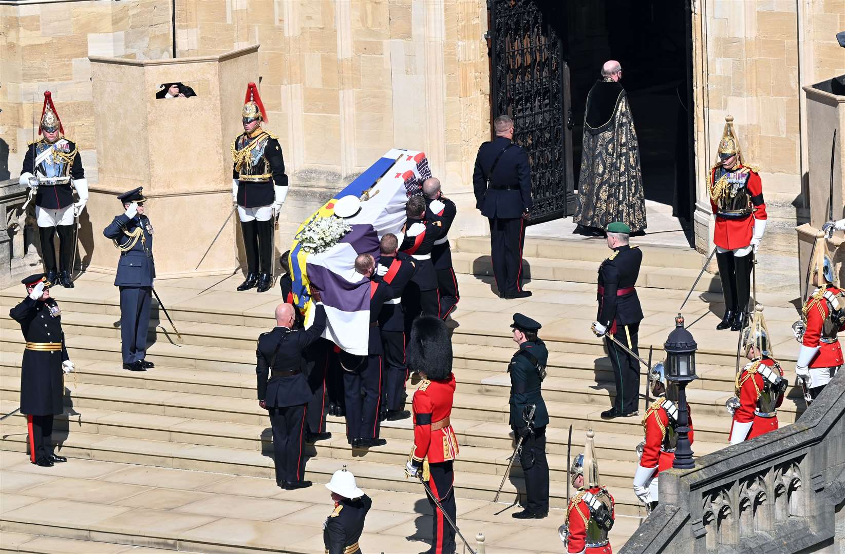 The Duke of Edinburgh’s coffin, covered with his Personal Standard arrives at St George’s Chapel (Justin Tallis/PA)