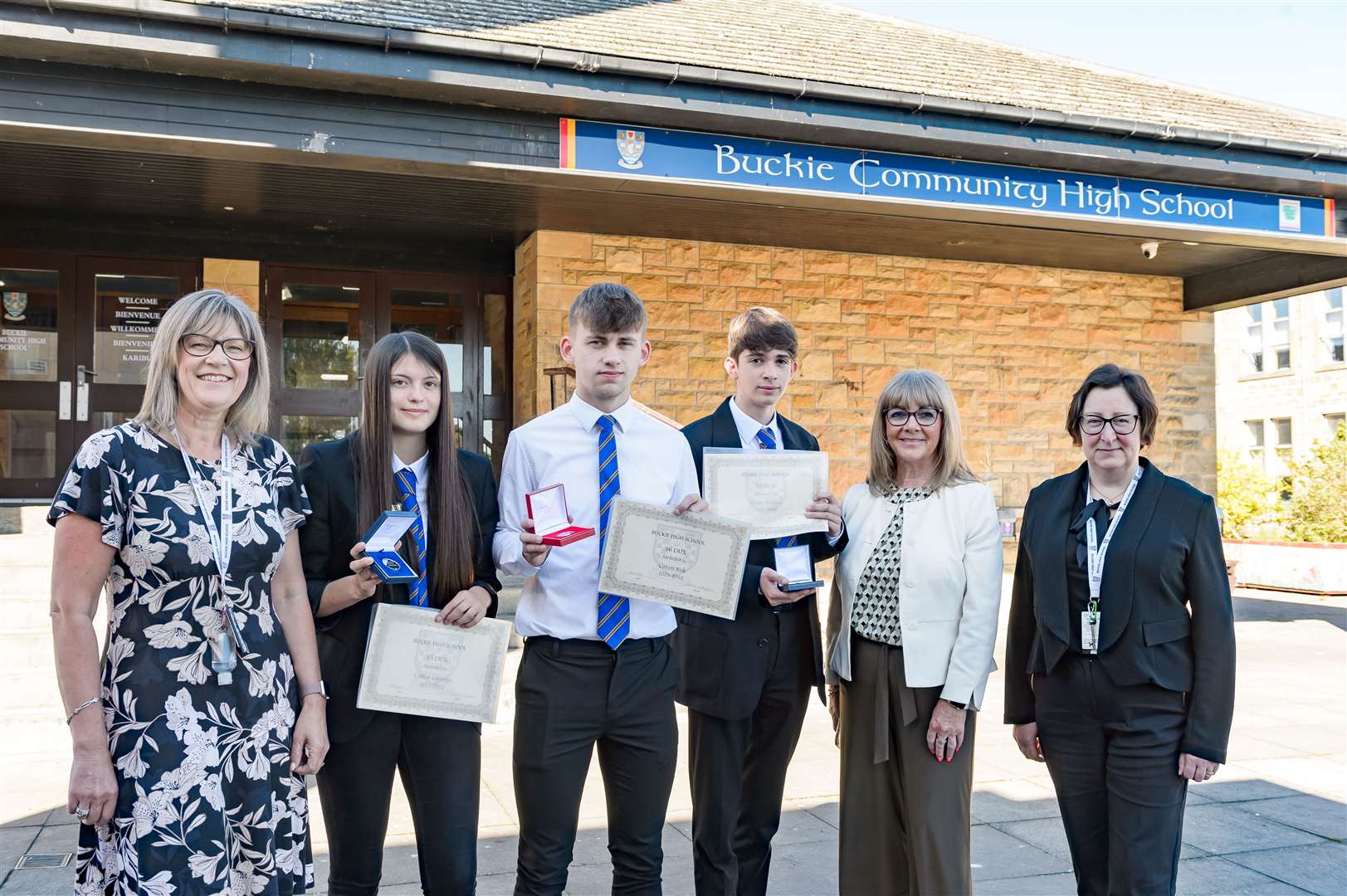 Duxes Caitlin Carnegie, Calum Risk (third left) and George Wallace are congratulated on their achievements by BCHS business support officer Yvonne Taylor (left) and depute rectors Moira Taylor (second right) and Liz Bain. Picture: Angus Mclennan