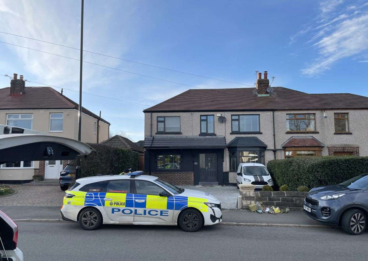 A police car parked outside a house on Hemper Lane, Greenhill, Sheffield, after a 12-year-old boy was arrested on suspicion of murder (Dave Higgens/PA)