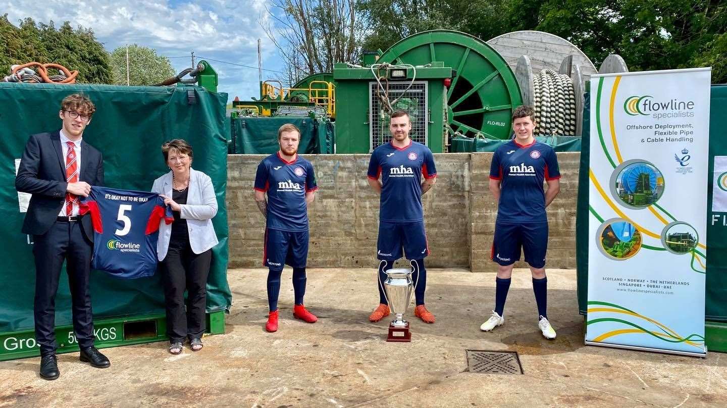 Fyvie chairman Connor Shepherd with Jan Foster of Flowline Specialists and players Tommy Gillan, Jamie Marshall and Stewie Sleigh.