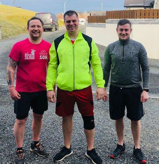 Ben Myers, centre, with running buddies, Daniel Carter, right, and Shaun Nicol.