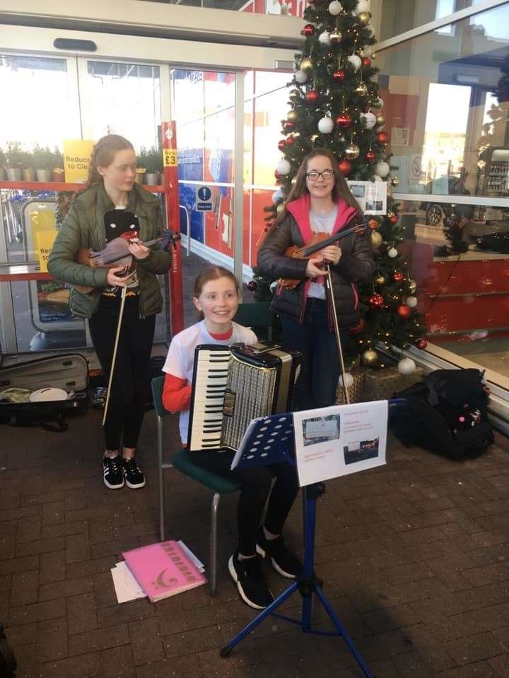 The Country Quines at Keith Tesco on Hogmanay, where they raised £655 for charities.