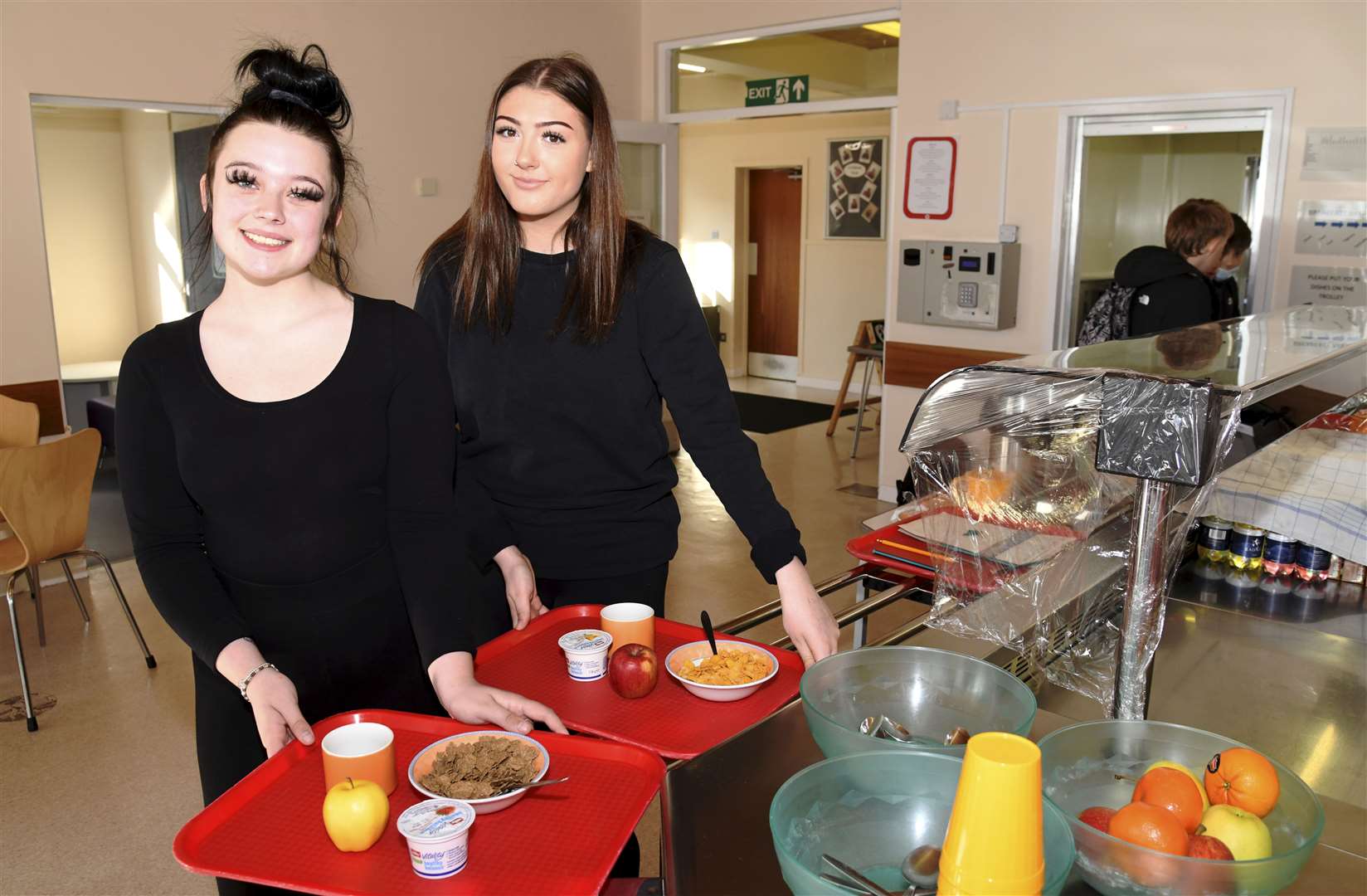 Breakfast club helpers Leoni Campbell (left) and Emma Cheyne show off some of the healthy options available to students. Picture: Becky Saunderson