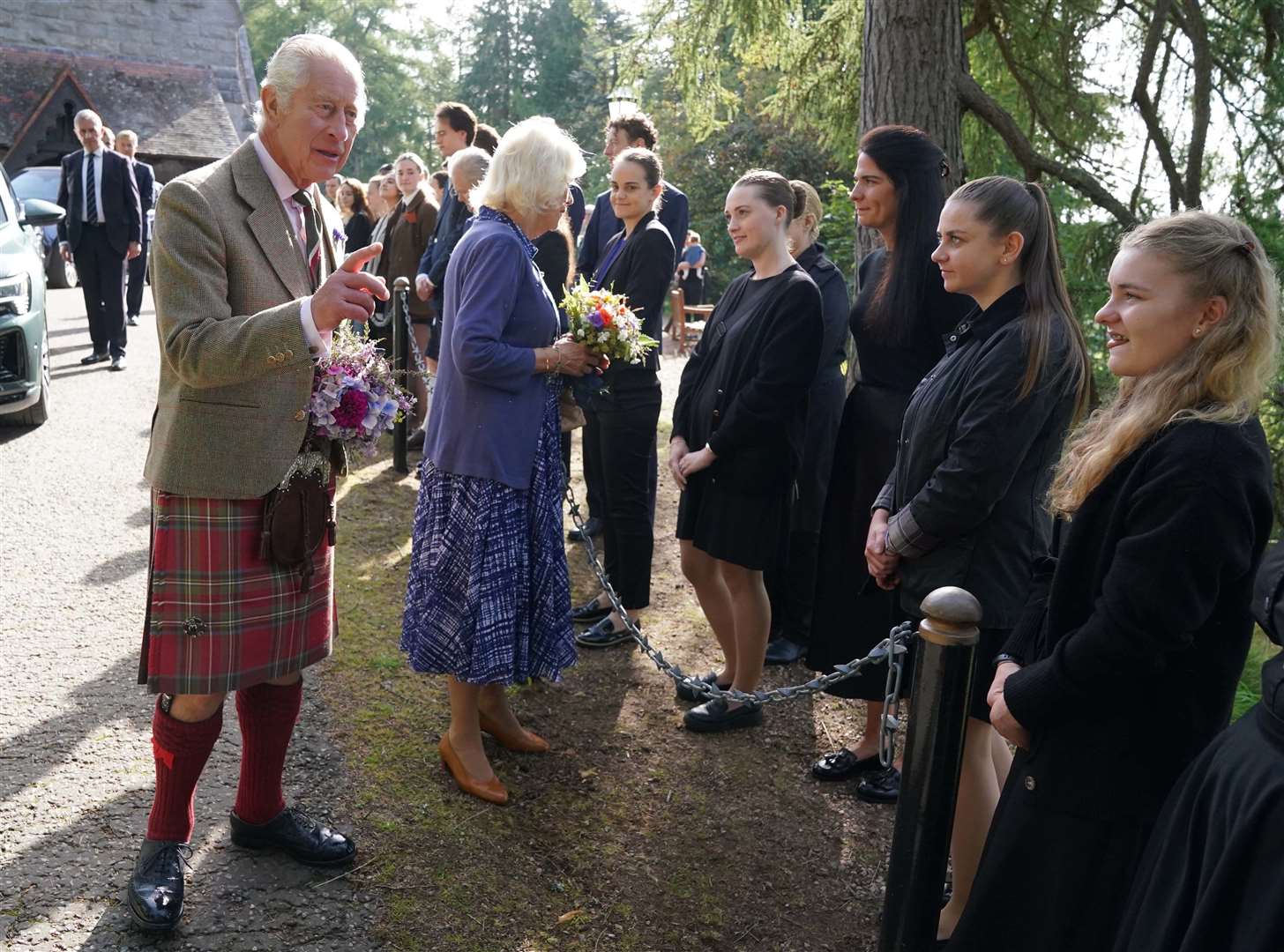 The King and Queen meet estate staff and members of the public after a church service to mark the first anniversary of the death of Queen Elizabeth II (Andrew Milligan/PA)